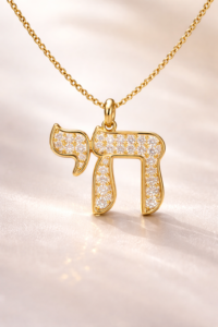 Gold Aleph (א) Hebrew letter pendant with diamonds illustrating the spiritual meaning of Hebrew letters art and divine unity symbolism.